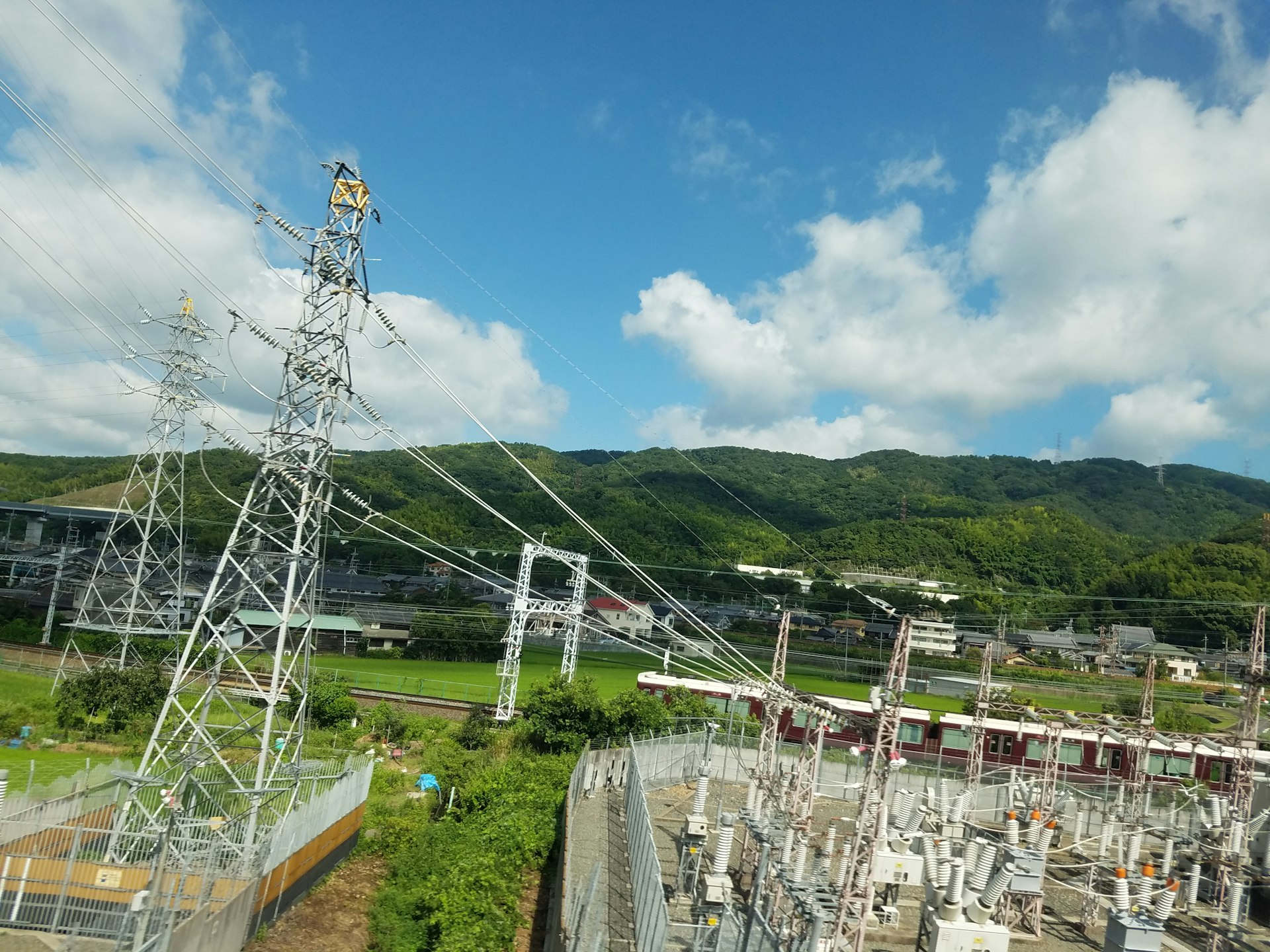 a view of a power line with a mountain in the background
